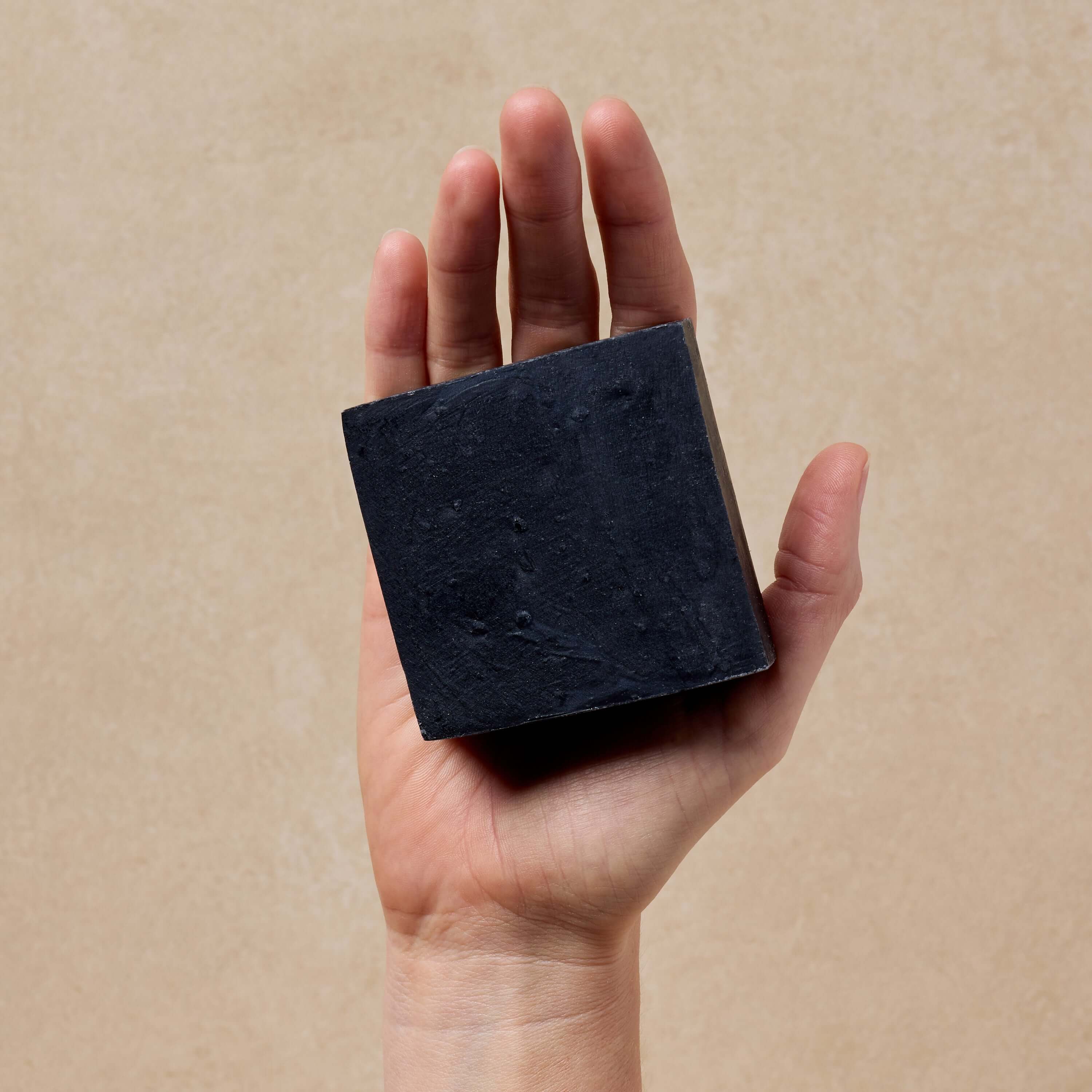 woman-holds-tallow-soap-in-her-hand