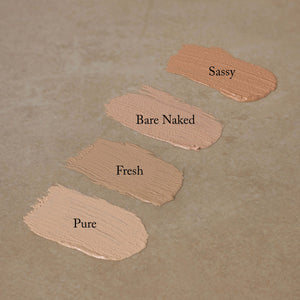 nontoxic-cream-concealer-shades-swatched-on-brown-surface