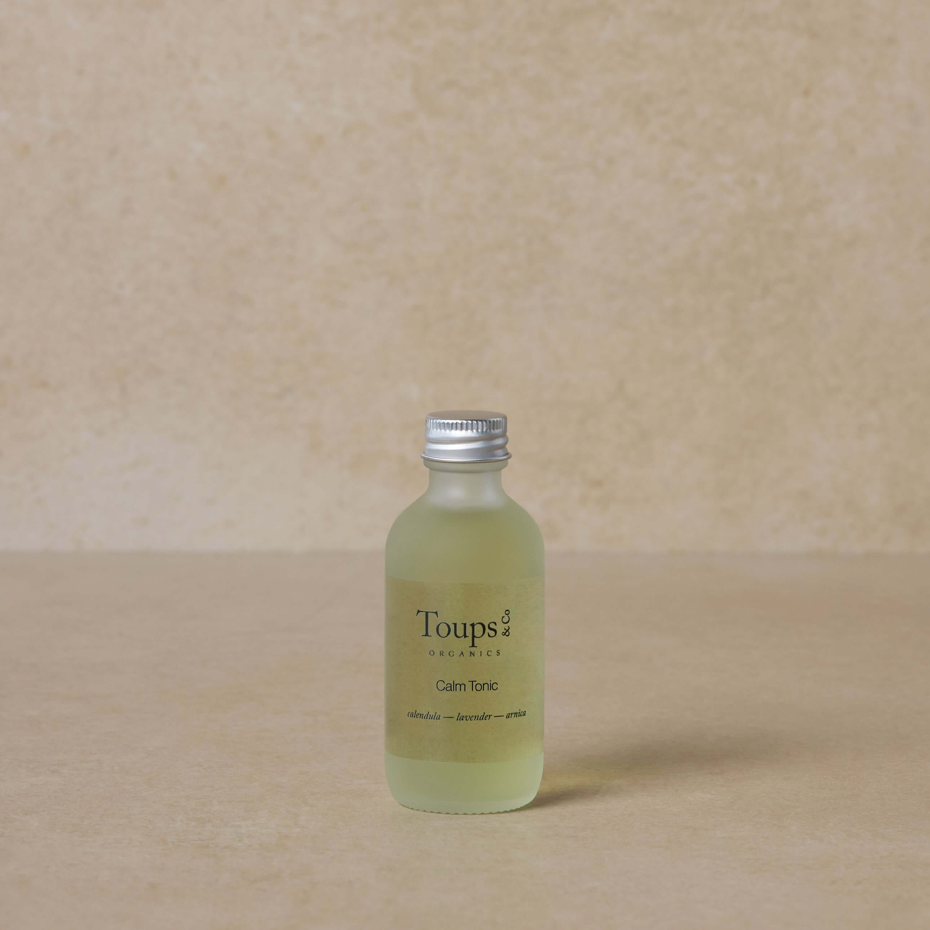 facial-tonic-for-redness-with-brown-background