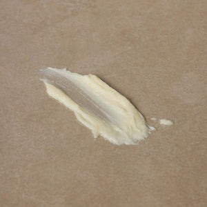 textured-photo-of-tallow-balm-against-brown-surface