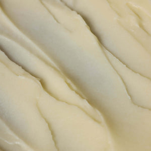 Close-up of smooth, creamy Tallow Balm - Mistletoe by Toups and Co Organics—ideal for Christmas gifts.
