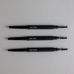 Toups & Co non-toxic brow pencils in Soft Taupe, Deep Taupe, and Deep Brown with spoolie brush