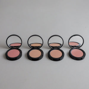 Four shades of natural pressed mineral blush compacts open with mirrors